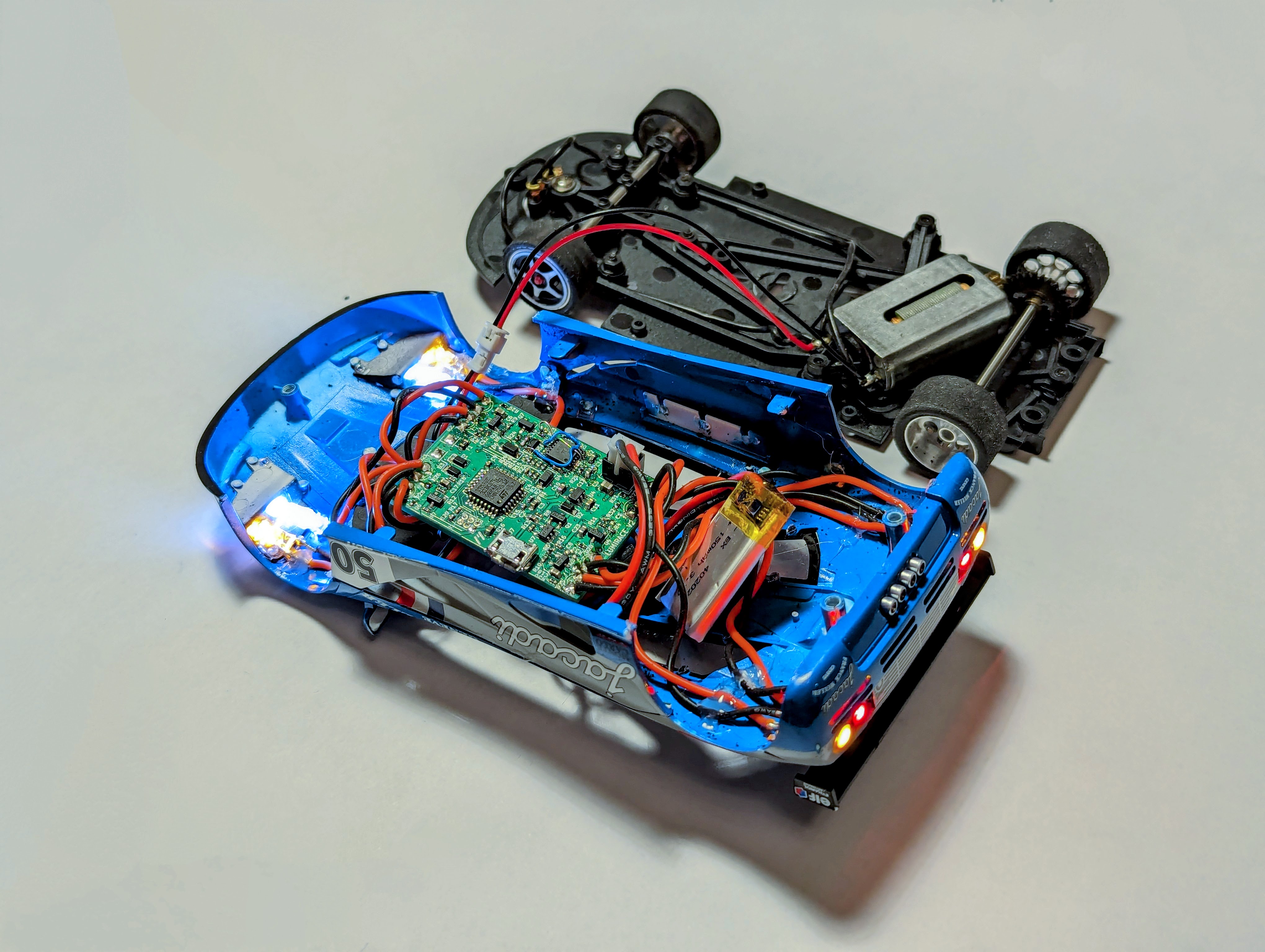 Photo of the LumiRace Prototype in a slot car