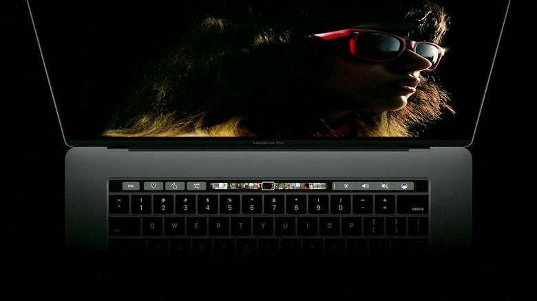 An Apple Macbook with a Touchbar.