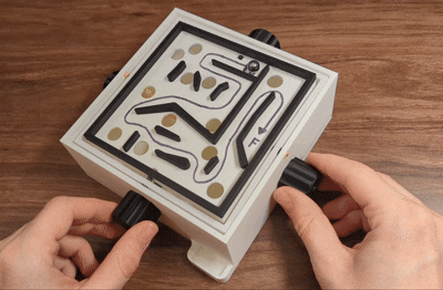 An animation of a 3d printed marble labyrinth game.