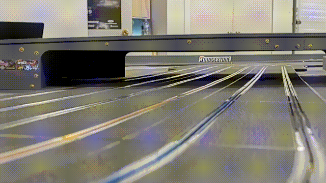 An animation showing a slot car approaching a corner, and the tail lights activate when it slows down.
