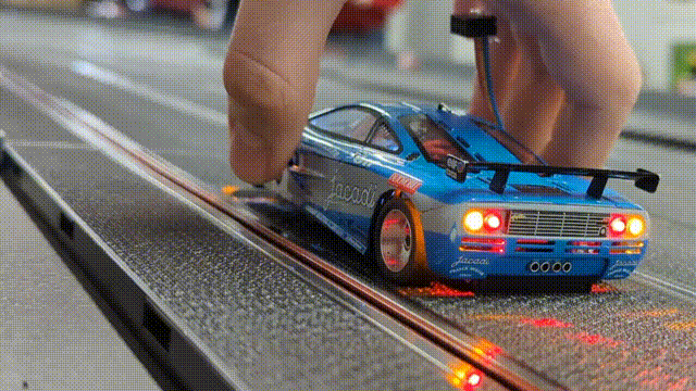 An animation showing a slot car approaching a corner, and the tail lights activate when it slows down.